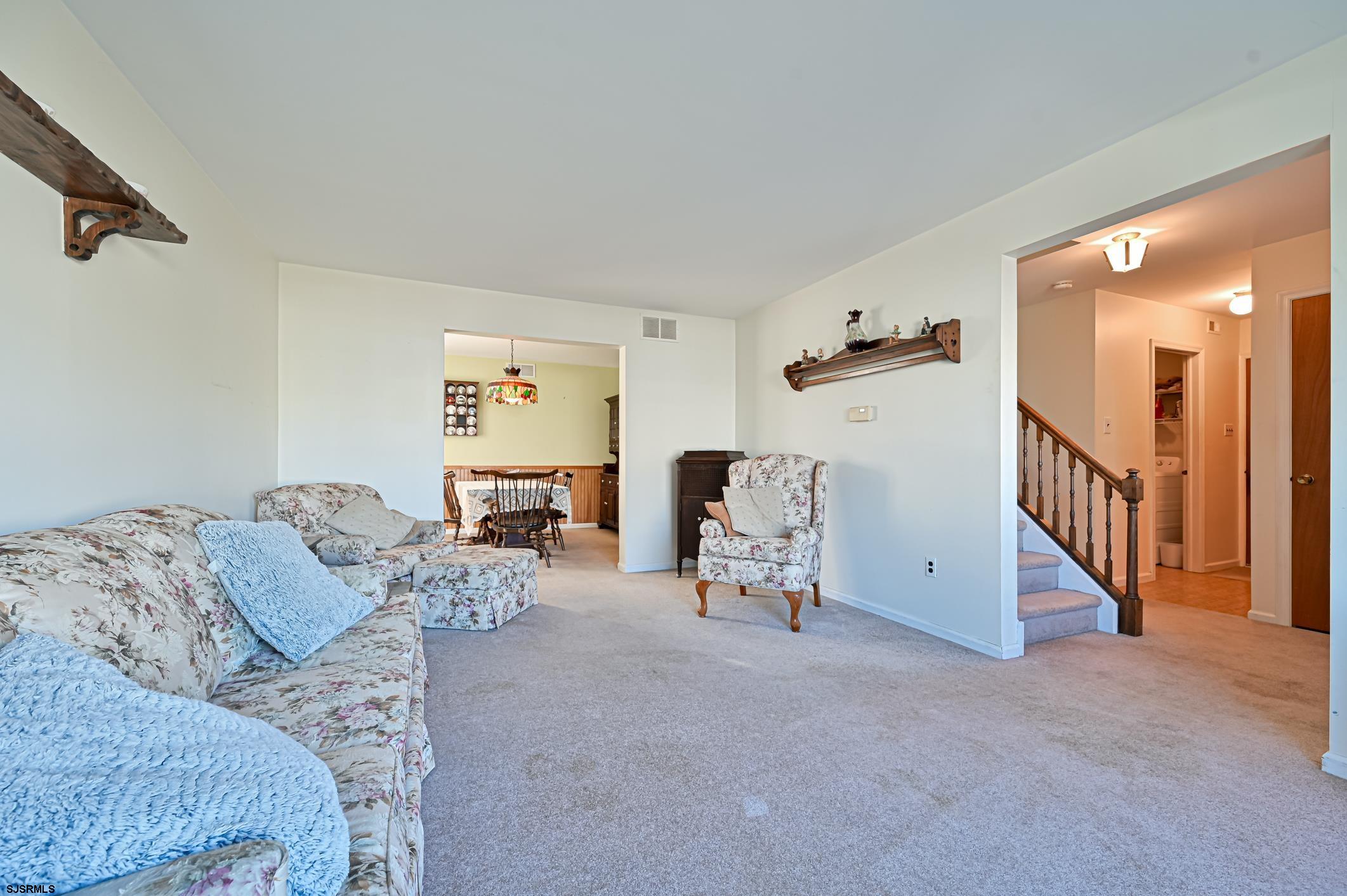 16 MacDermott Place Brigantine, NJ 08203 - Photo 7 of 37 a living room with furniture and a large window