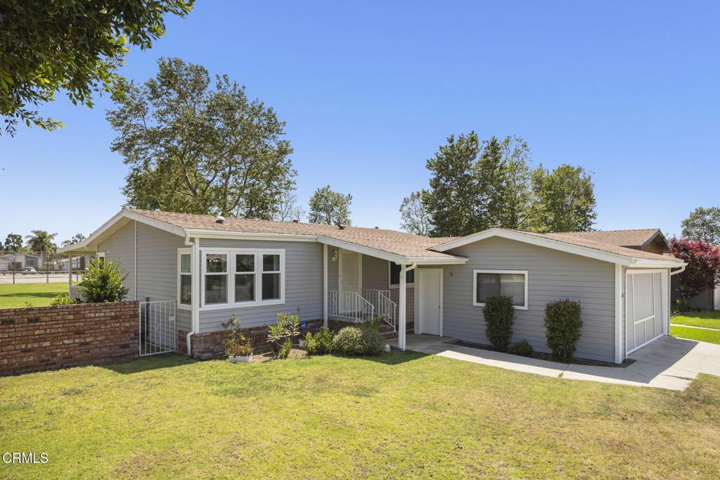 400 Dewberry Lane, Unit 101 Oxnard, CA 93036 - Photo 1 of 37 a house with yard in front of it