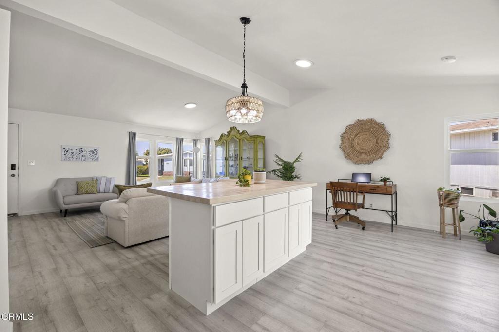 400 Dewberry Lane, Unit 101 Oxnard, CA 93036 - Photo 12 of 37 a very nice looking room with a large window wooden floor and furniture