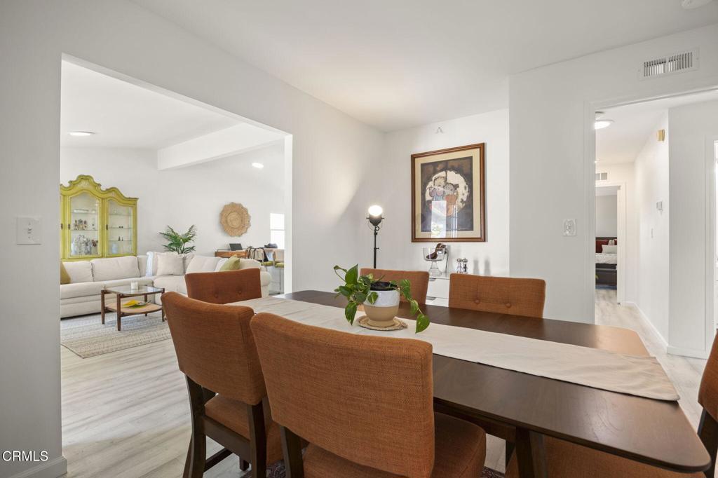 400 Dewberry Lane, Unit 101 Oxnard, CA 93036 - Photo 15 of 37 a view of a dining room with furniture and wooden floor