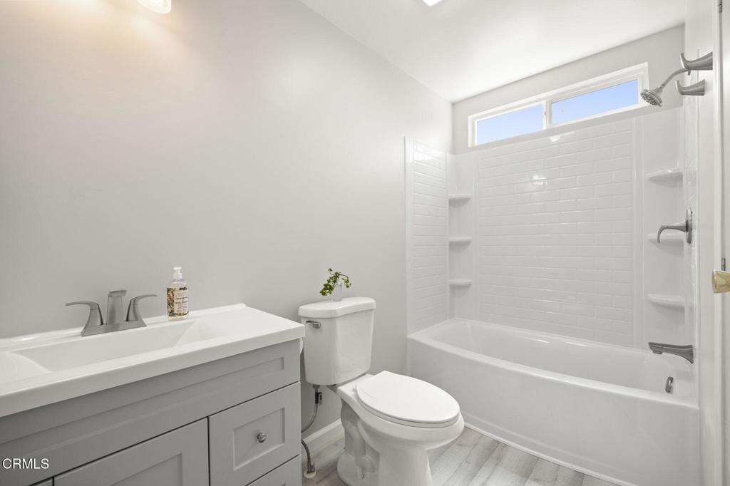 400 Dewberry Lane, Unit 101 Oxnard, CA 93036 - Photo 19 of 37 a bathroom with a sink toilet and shower
