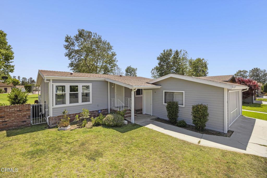 400 Dewberry Lane, Unit 101 Oxnard, CA 93036 - Photo 2 of 37 a view of a house with backyard and sitting area