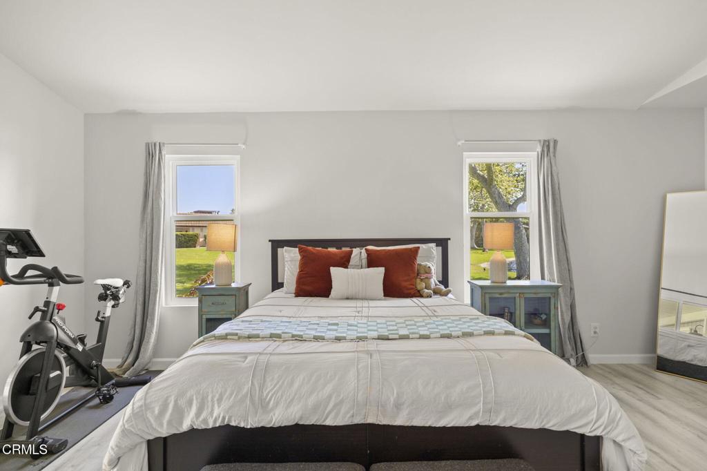 400 Dewberry Lane, Unit 101 Oxnard, CA 93036 - Photo 21 of 37 a bedroom with a bed and a window