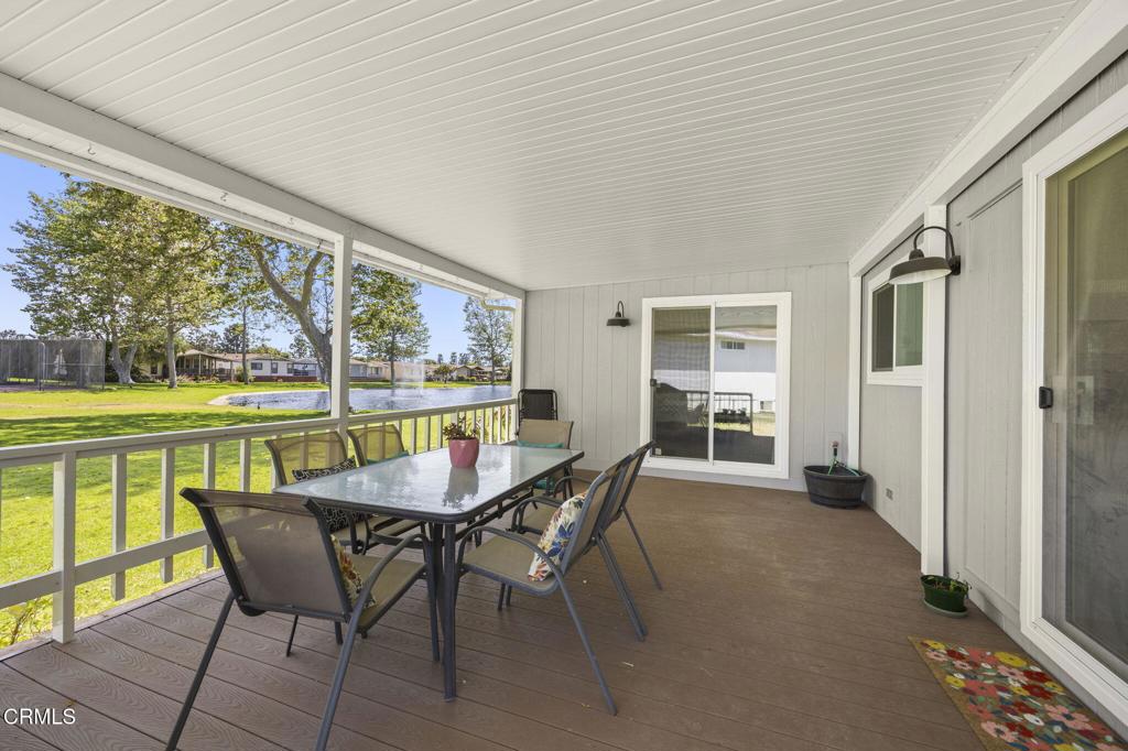 400 Dewberry Lane, Unit 101 Oxnard, CA 93036 - Photo 27 of 37 a dining room with furniture and a floor to ceiling window