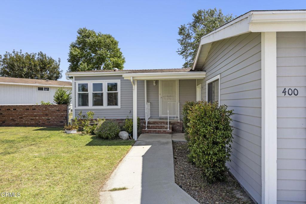 400 Dewberry Lane, Unit 101 Oxnard, CA 93036 - Photo 4 of 37 a front view of a house with garden