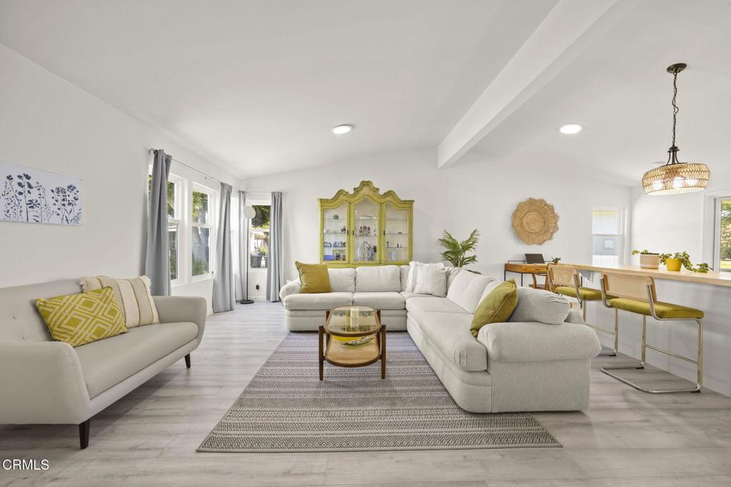 400 Dewberry Lane, Unit 101 Oxnard, CA 93036 - Photo 6 of 37 a living room with furniture and a large window