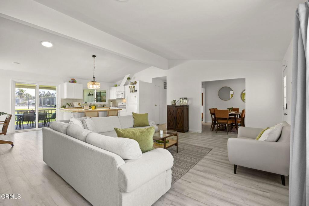 400 Dewberry Lane, Unit 101 Oxnard, CA 93036 - Photo 7 of 37 a living room with furniture and wooden floor