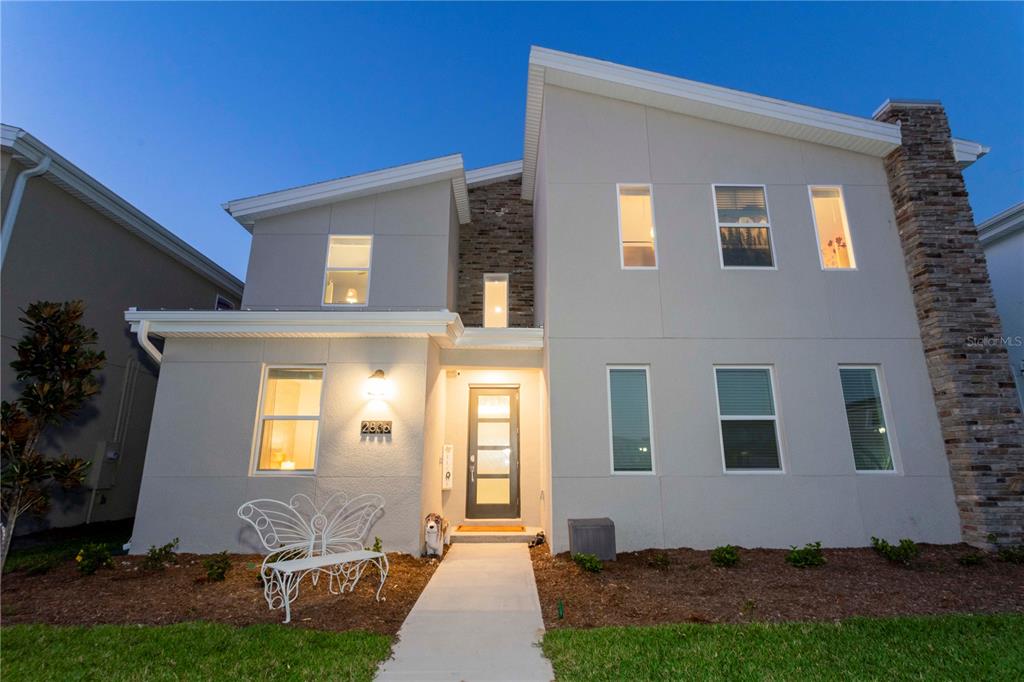 a front view of a house with a yard