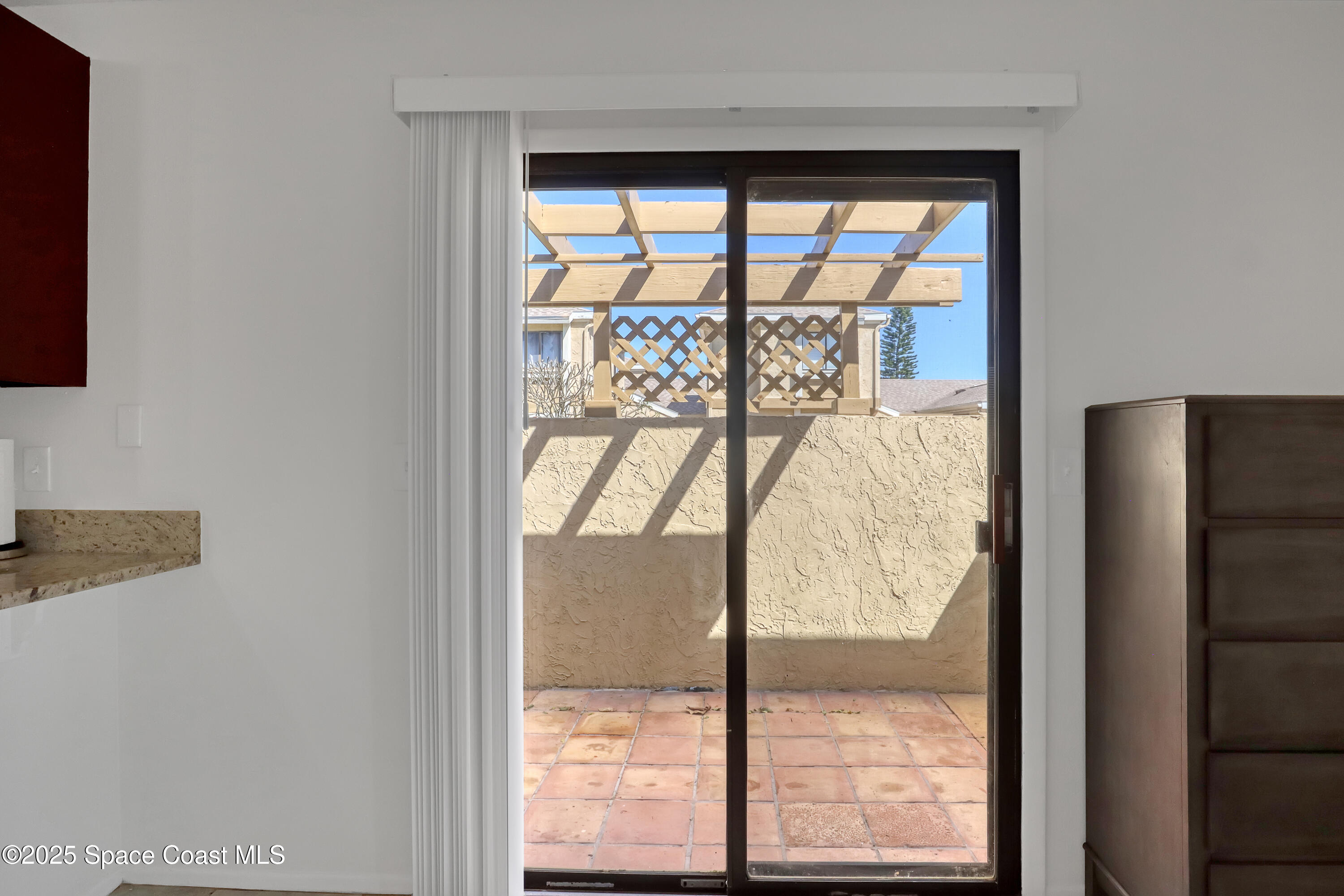 1031 Abada Court Northeast, Unit 110 Palm Bay, FL 32905 - Photo 12 of 33 a view of a room with a large window