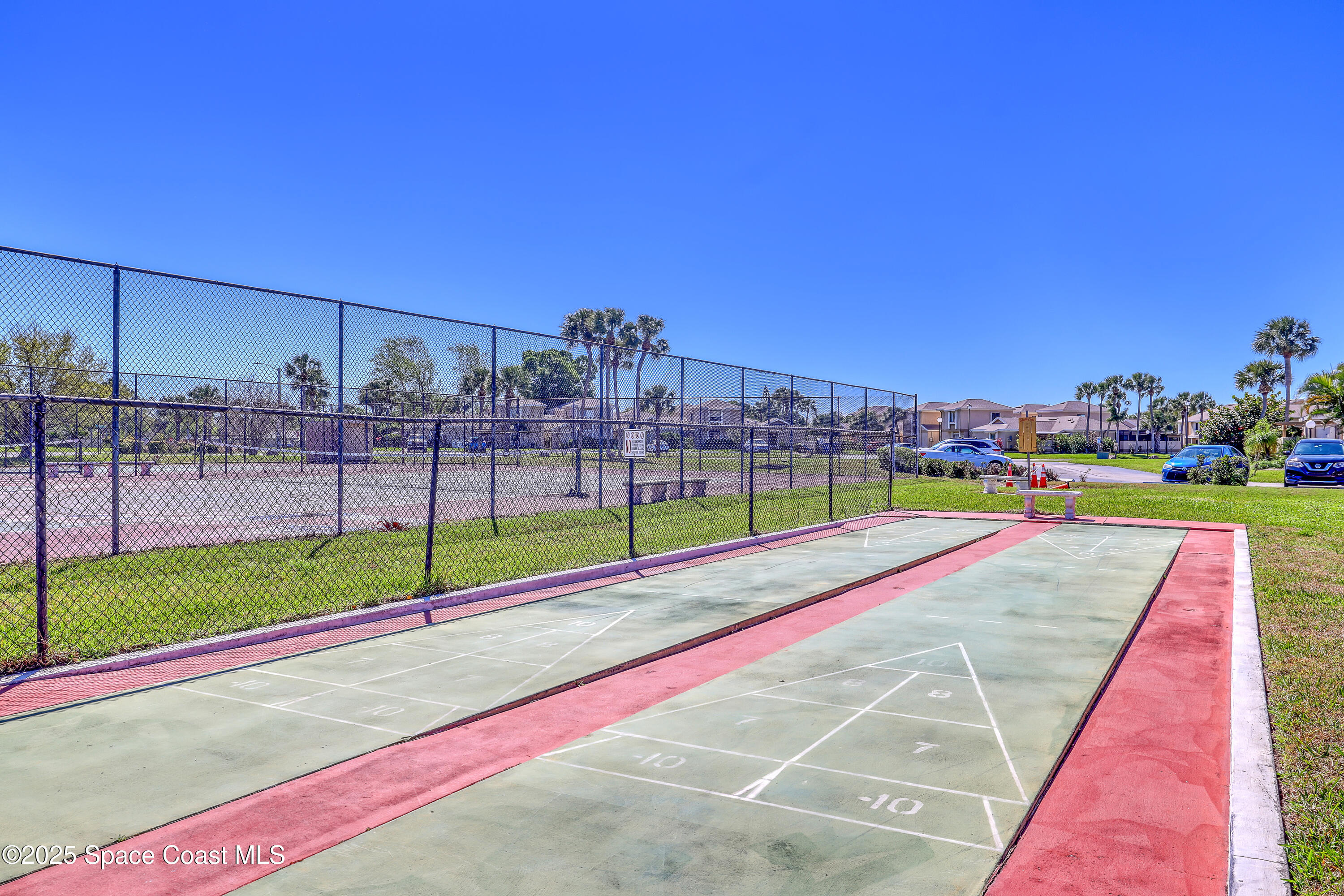 1031 Abada Court Northeast, Unit 110 Palm Bay, FL 32905 - Photo 28 of 33 a view of an outdoor space and tennis court