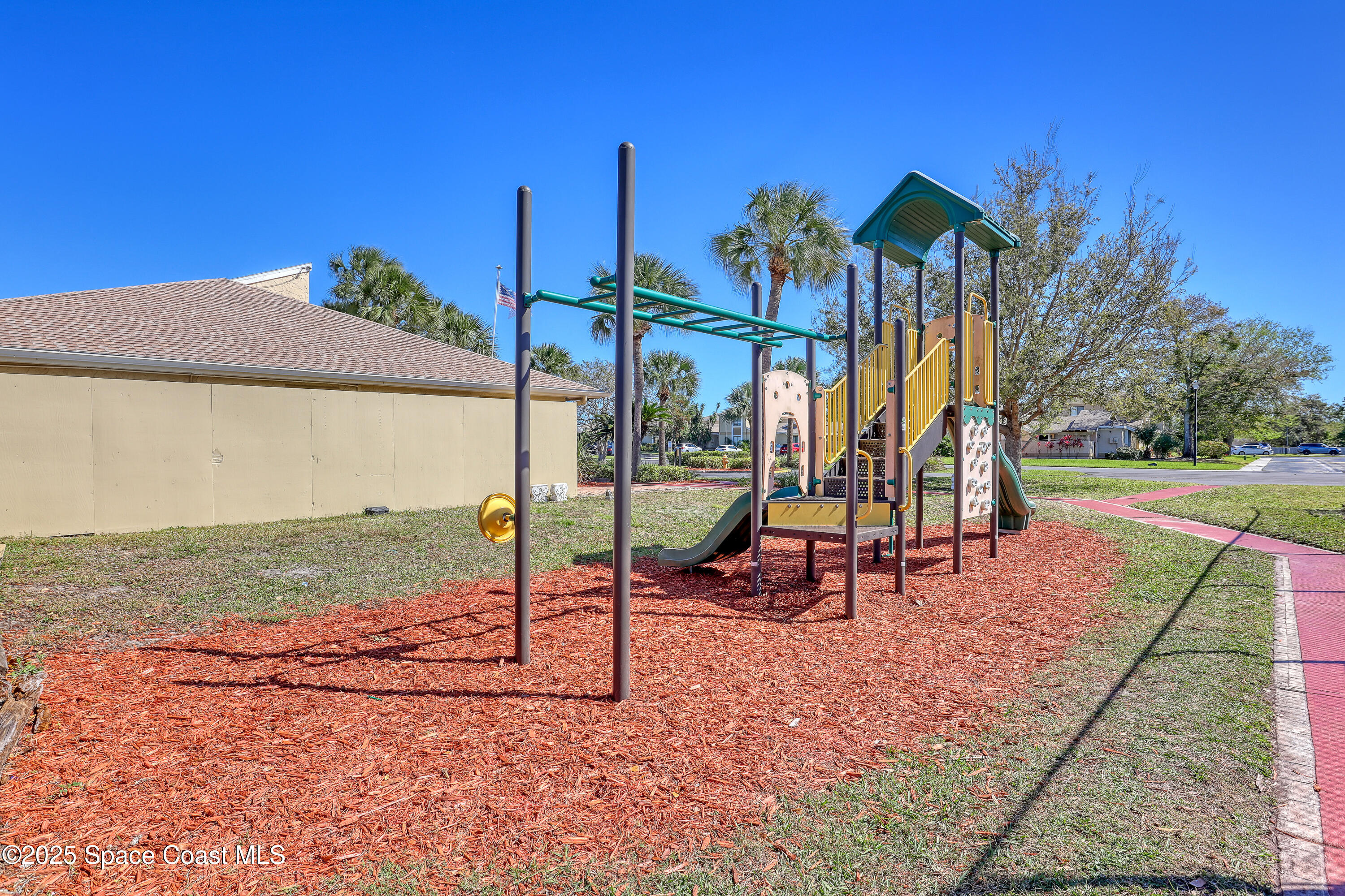 1031 Abada Court Northeast, Unit 110 Palm Bay, FL 32905 - Photo 31 of 33 a view of a park with slide