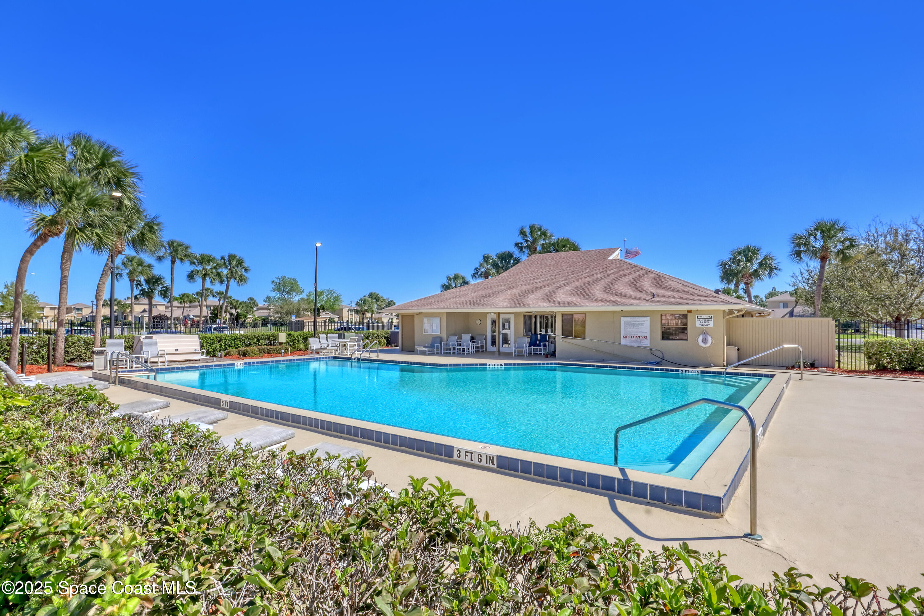 1031 Abada Court Northeast, Unit 110 Palm Bay, FL 32905 - Photo 33 of 33 a view of a backyard with sitting area