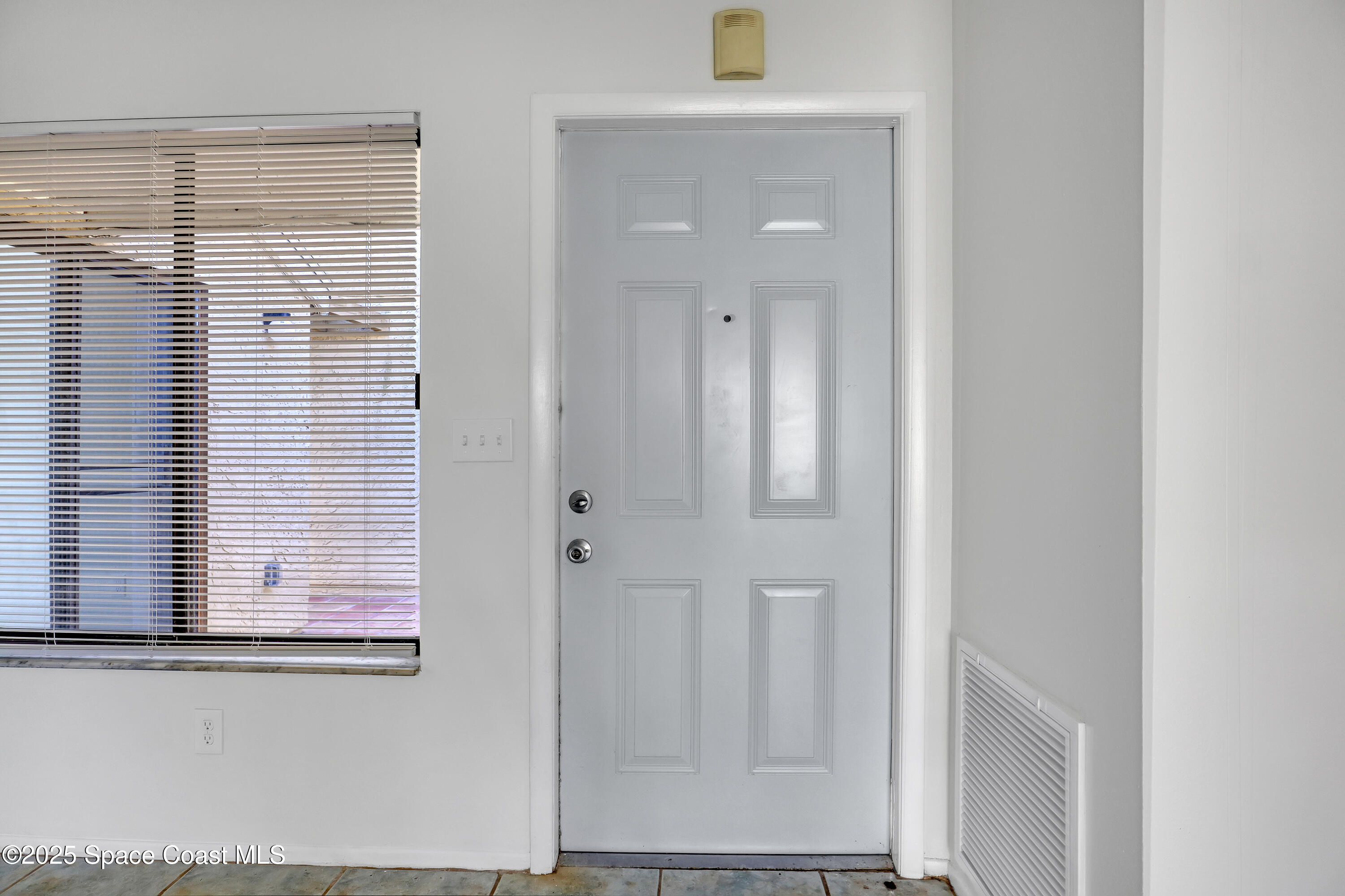 1031 Abada Court Northeast, Unit 110 Palm Bay, FL 32905 - Photo 8 of 33 view of empty room with window
