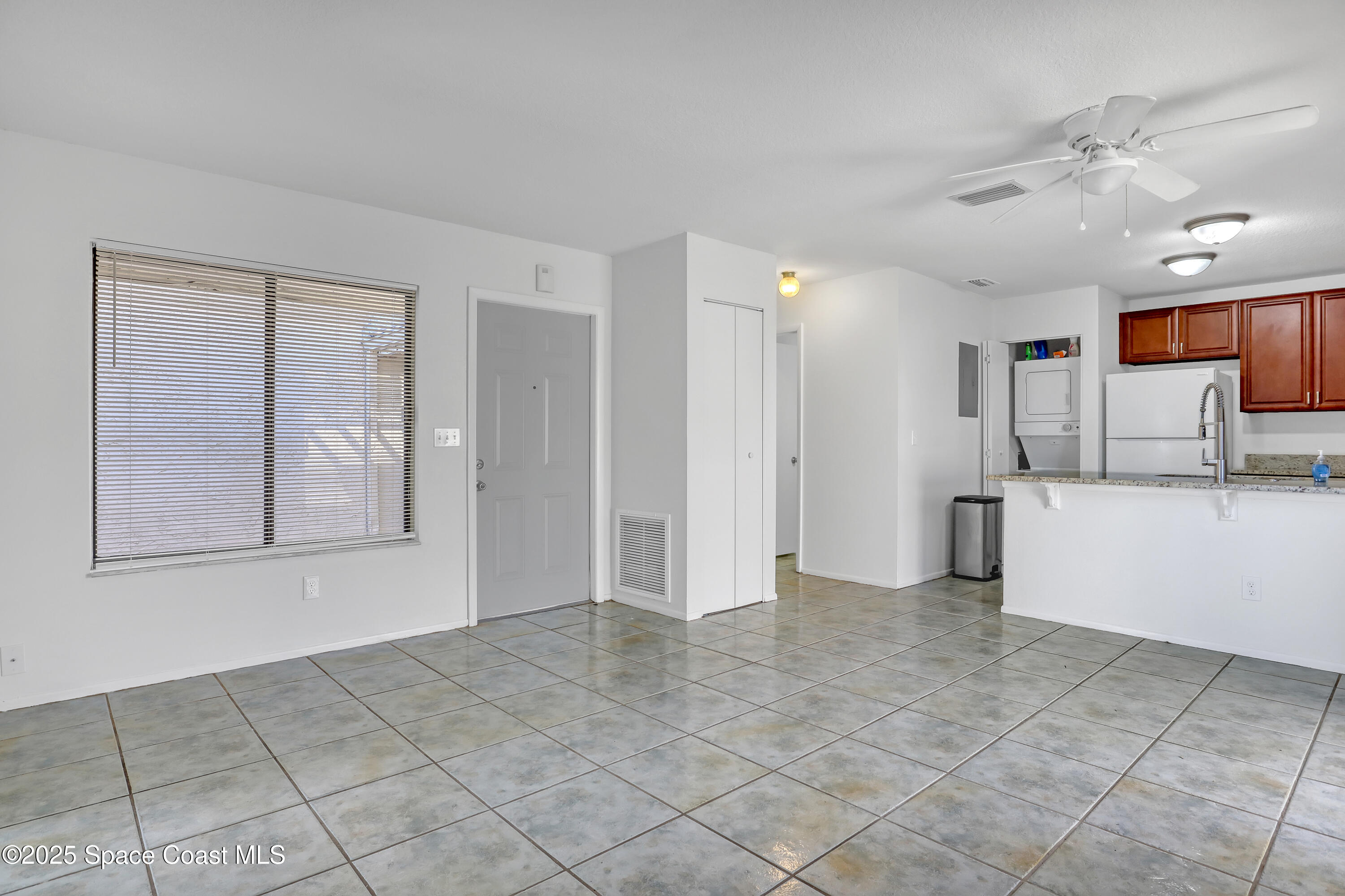 1031 Abada Court Northeast, Unit 110 Palm Bay, FL 32905 - Photo 10 of 33 a view of a kitchen with a sink and cabinet area