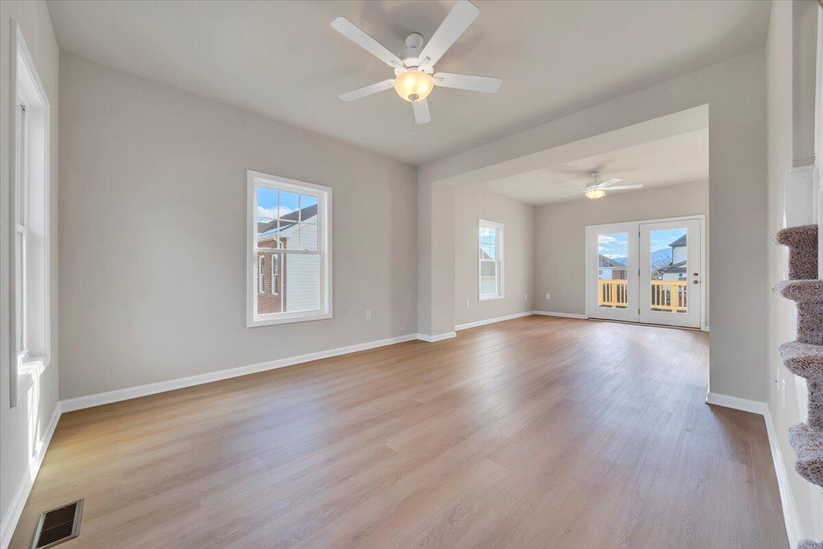3711 Crescent Ridge Drive Southwest Roanoke, VA 24015 - Photo 2 of 23 wooden floor in an empty room with a window