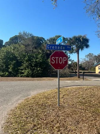 a sign board with a lake view