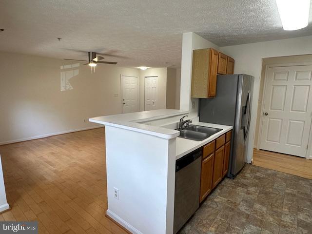 696 Winding Stream Way, Unit 104 Odenton, MD 21113 - Photo 11 of 21 a kitchen with a sink appliances and cabinets