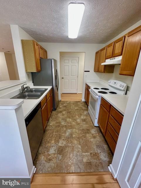 696 Winding Stream Way, Unit 104 Odenton, MD 21113 - Photo 12 of 21 a kitchen with sink stove and refrigerator