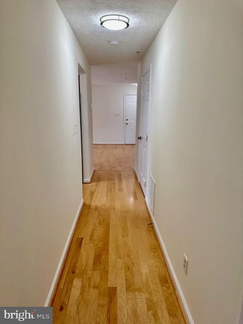 696 Winding Stream Way, Unit 104 Odenton, MD 21113 - Photo 21 of 21 a view of hallway with wooden floor