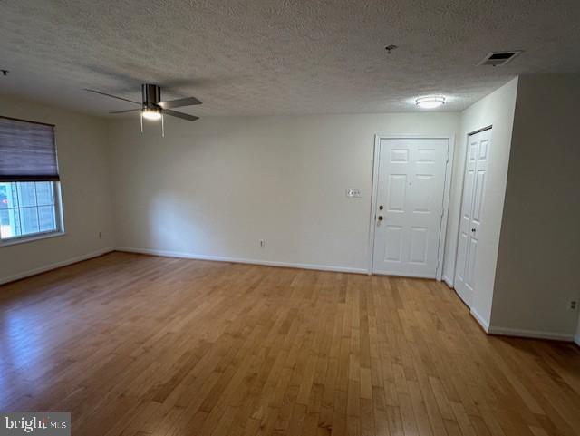696 Winding Stream Way, Unit 104 Odenton, MD 21113 - Photo 9 of 21 an empty room with a empty space and a ceiling fan