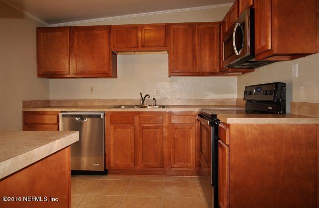 10326 Lawson Road Jacksonville, FL 32246 - Photo 13 of 19 a kitchen with stainless steel appliances granite countertop a refrigerator and a sink