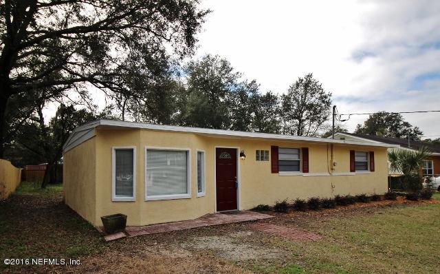 10326 Lawson Road Jacksonville, FL 32246 - Photo 2 of 19 a view of a house with a yard