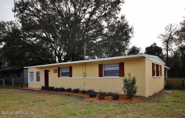 10326 Lawson Road Jacksonville, FL 32246 - Photo 3 of 19 a house with trees in front of it