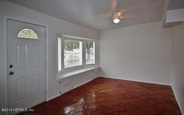 10326 Lawson Road Jacksonville, FL 32246 - Photo 10 of 19 an empty room with windows and closet