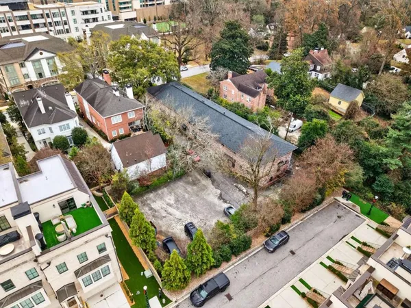 an aerial view of a residential houses with outdoor space