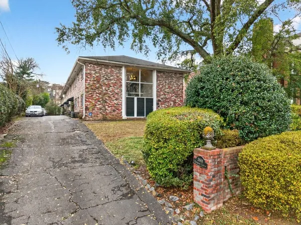 front view of a house with a garden
