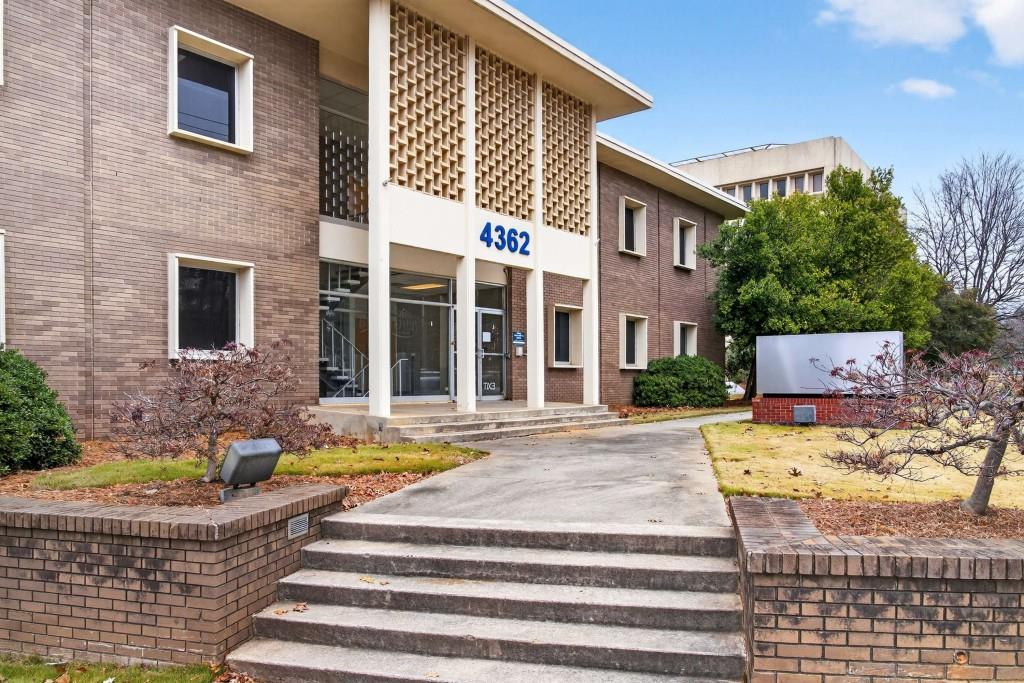 3668 Kingsboro Road Northeast Atlanta, GA 30319 - Photo 25 of 43 a front view of a house with swimming pool and porch