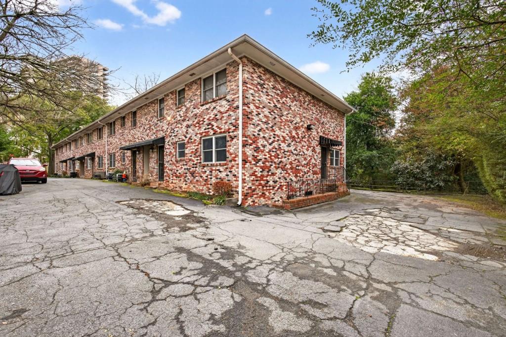 3668 Kingsboro Road Northeast Atlanta, GA 30319 - Photo 10 of 43 a front view of a house with garden