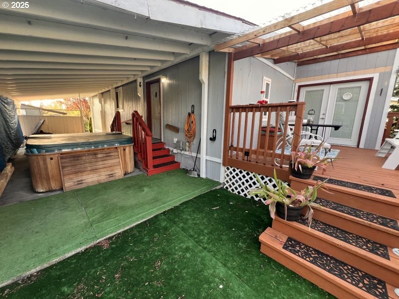 481 Hillside Loop Seaside, OR 97138 - Photo 16 of 47 a view of a porch with furniture and a yard