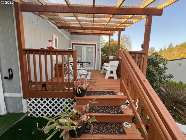a view of balcony with wooden floor