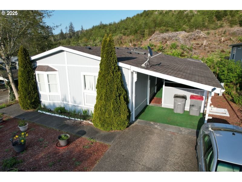 481 Hillside Loop Seaside, OR 97138 - Photo 3 of 47 a view of a front of house with a yard