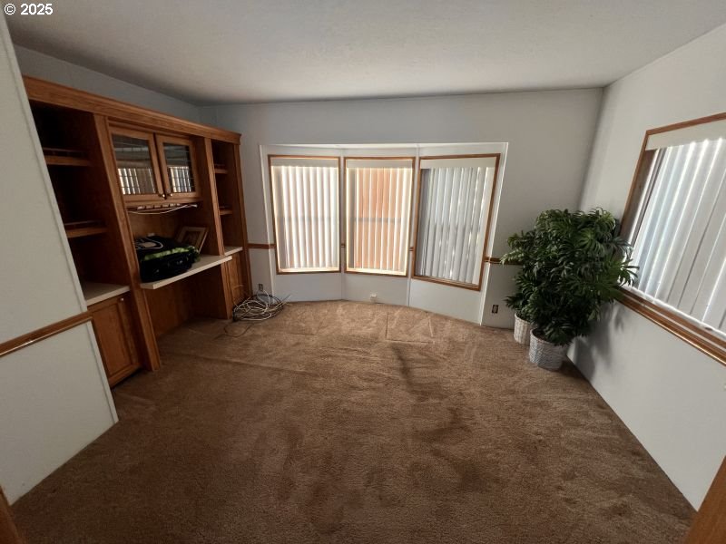 481 Hillside Loop Seaside, OR 97138 - Photo 33 of 47 an empty room with windows