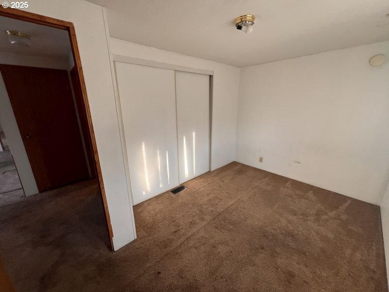 481 Hillside Loop Seaside, OR 97138 - Photo 38 of 47 an empty room with a door