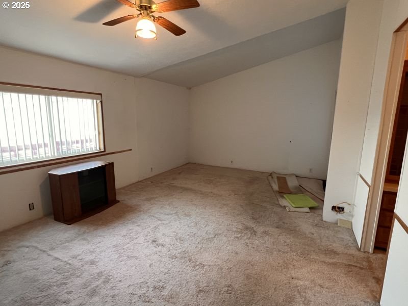 481 Hillside Loop Seaside, OR 97138 - Photo 41 of 47 an empty room with windows and fan