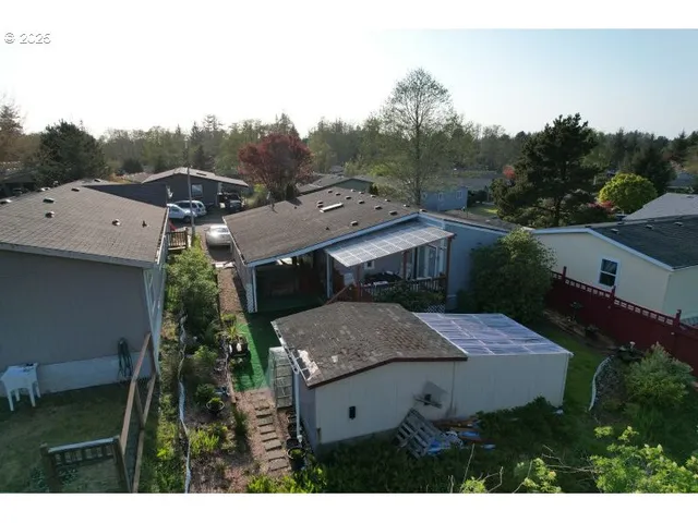 a view of a house with a field of the house