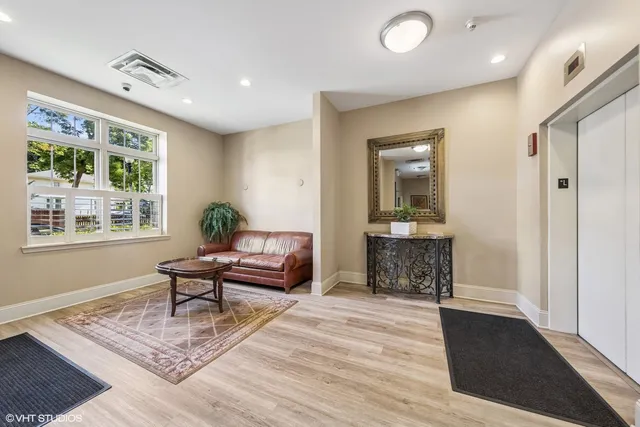 a living room with furniture and a table