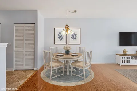 a dining room with furniture and window