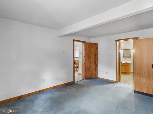 an empty room with closet area