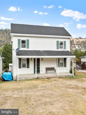 a front view of a house with a patio