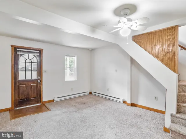a view of an empty room with a window
