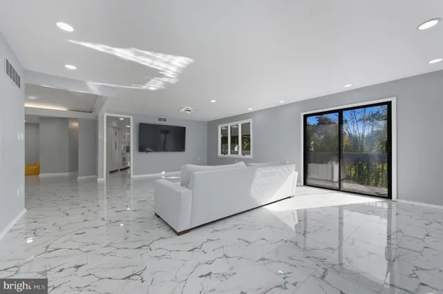 a bathroom with a shower sink vanity and mirror