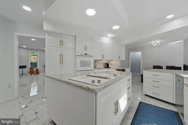 a bedroom with a large bed and a large window