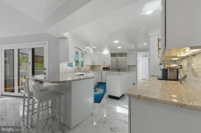 a bathroom with a sink a mirror and a shower