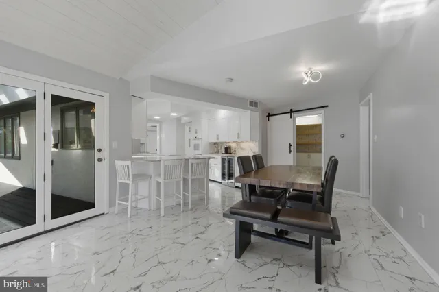 a bathroom with a sink a large mirror and a shower
