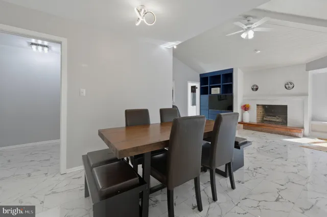 a living room with furniture fireplace and a flat screen tv