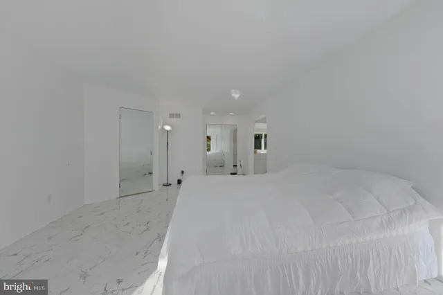 a view of storage and utility room with closet